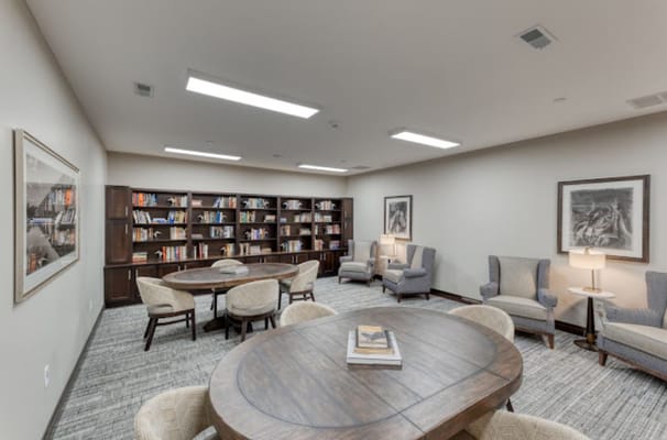 Interior view of a cozy common area with bookshelves