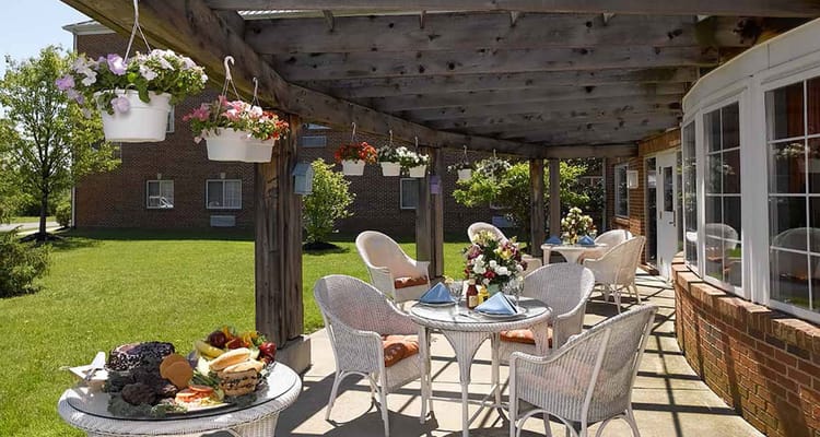 Outdoor patio area with seating and food setup