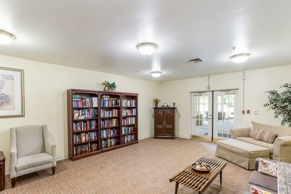 Interior common area with seating and bookshelves