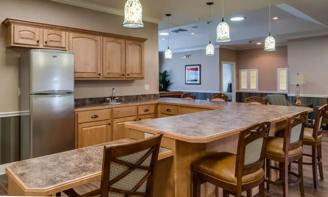 Warm kitchen space with a large island and seating