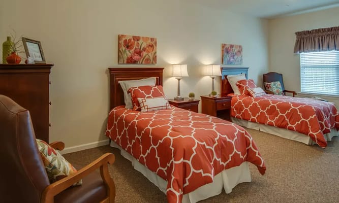 Bright bedroom with two twin beds and warm decor