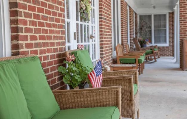 A welcoming outdoor seating area with green chairs
