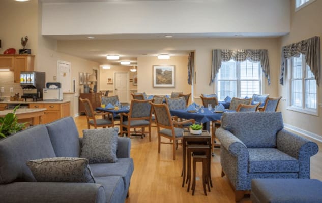 Bright common area with seating and tables