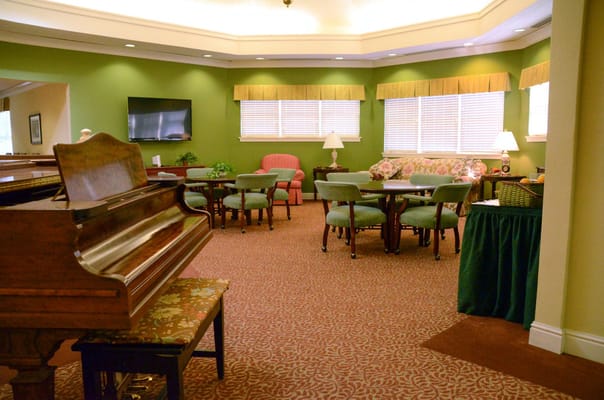 Interior lounge area with seating and a piano