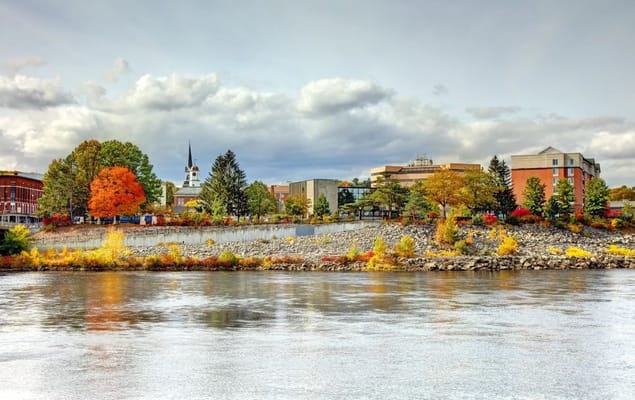 Scenic view of a senior living facility along a river