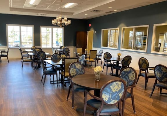 Elegant dining room with tables and chairs at Community Place
