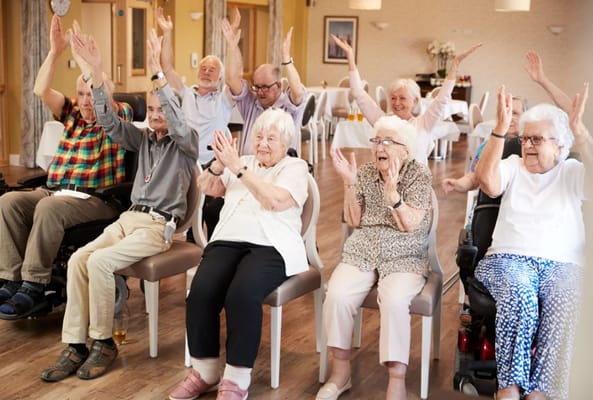 Residents enjoying a lively activity in a common area