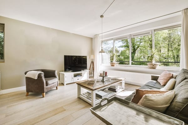 Bright, cozy common area with a view of greenery