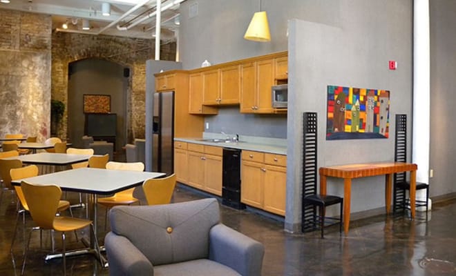 Modern common area with seating and kitchen