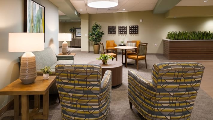 Cozy seating area with lamps and plants in Cranberry Park
