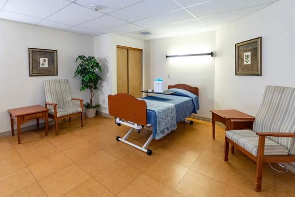 Private resident room with bed and seating area