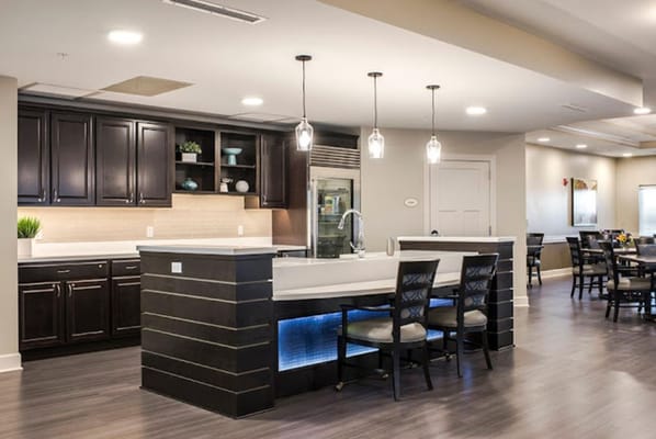 Modern dining area with kitchen and seating