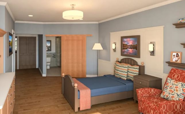 A well-furnished resident room in a senior living facility