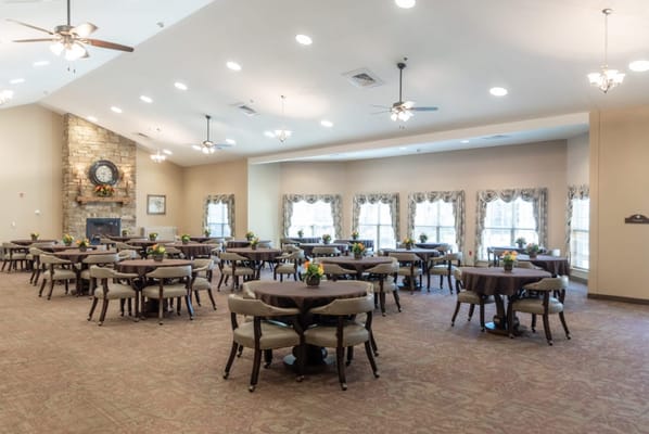 Bright dining room with tables set for meals