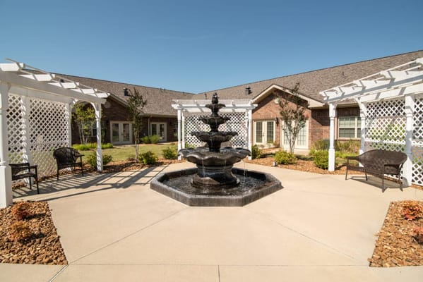 Outdoor courtyard with a fountain and seating