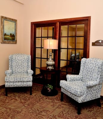 Cozy interior seating area with chairs and lamp