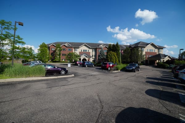 Exterior view of The Wellington at North Bend Crossing and its parking lot