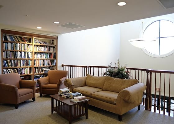 Cozy lounge area with a bookshelf and seating