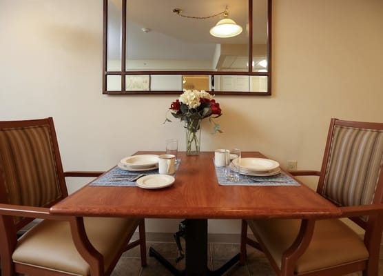 Dining area with table set for a meal