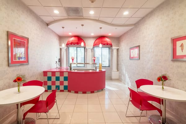 Colorful ice cream parlor with seating area