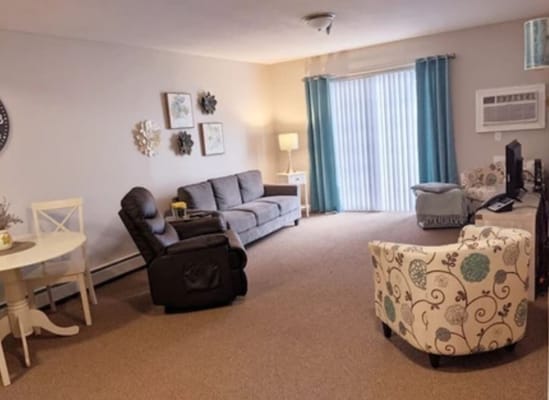 Bright interior of a cozy common room with seating