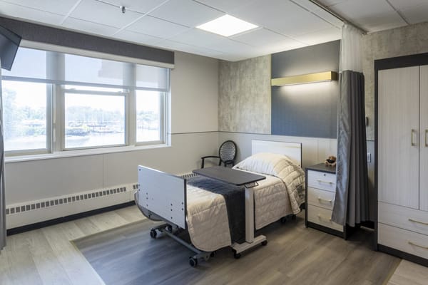 A well-furnished private bedroom in a nursing home