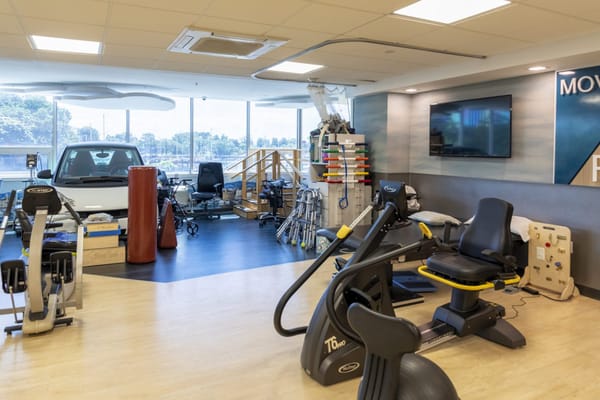 Rehabilitation gym with exercise equipment and therapy tools