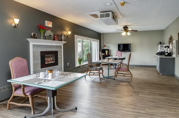Dining area with tables and chairs in a common space