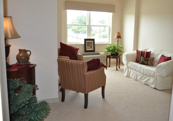 Cozy resident living room with chairs and natural light