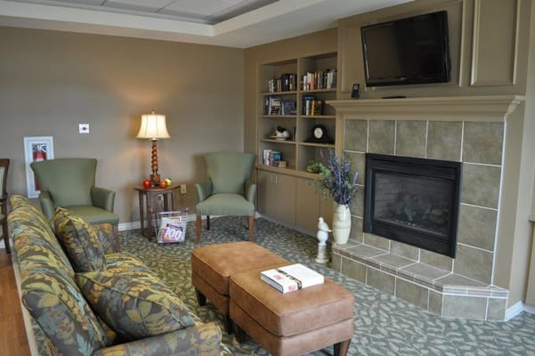 Common area with seating and a fireplace