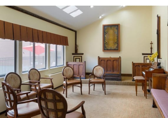 Interior of a common area with wooden chairs