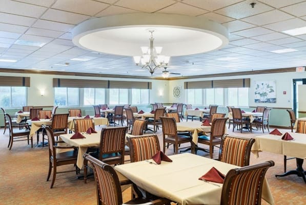 Bright dining room with tables set for meals