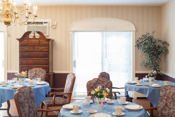 Cozy dining area with tables set for a meal