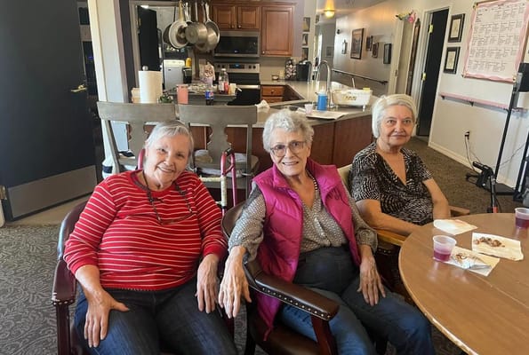 Three residents enjoying time together in a common area