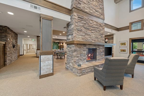 Interior view of a cozy lounge area with a fireplace