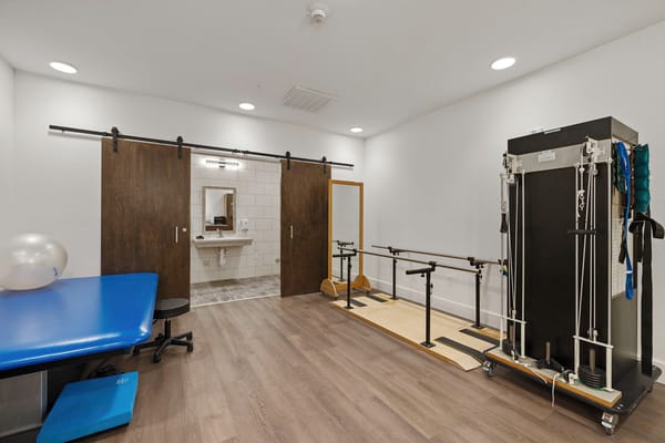 Physical therapy room with exercise equipment