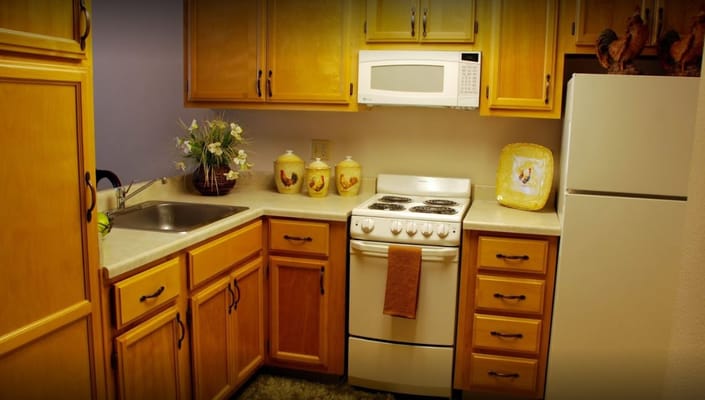 Spacious kitchen with wooden cabinets and modern appliances