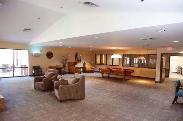 Spacious lounge with seating and a pool table