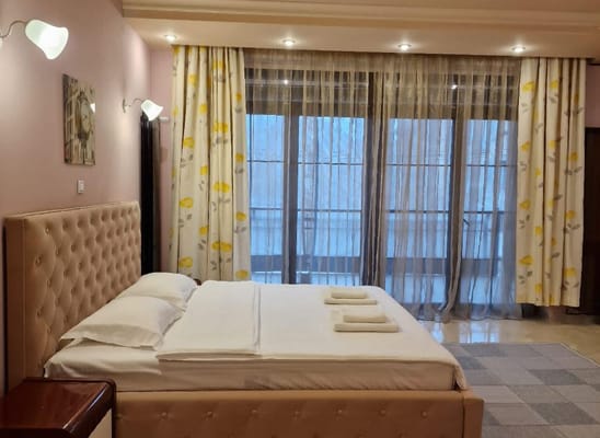 Well-decorated private resident bedroom with natural light