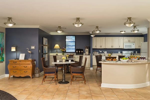 Bright common area with dining and kitchen space