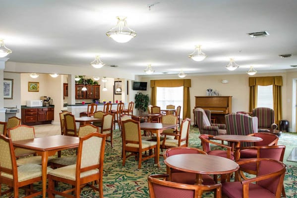 Bright dining area with tables and chairs