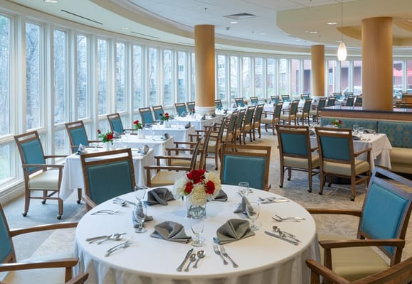 Bright dining room set for a meal.
