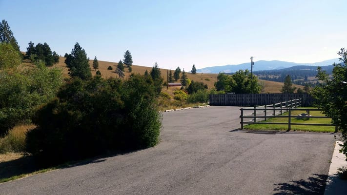 Outdoor view of a pathway and hills in the background