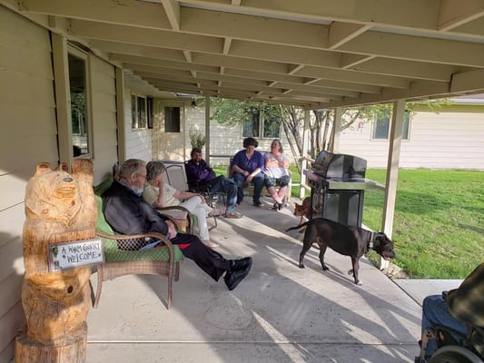 Residents enjoying time together on a porch