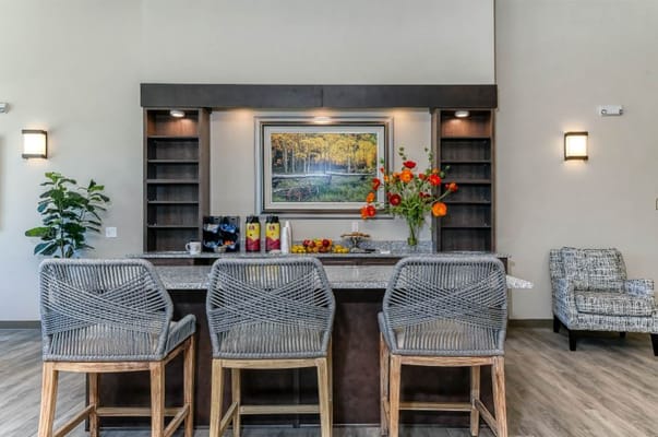 Bright social area with seating and floral decor