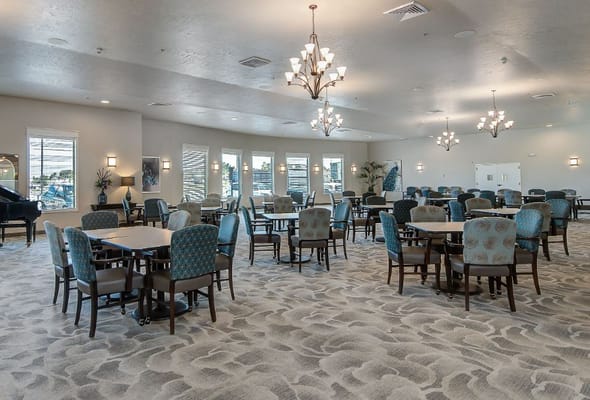 Common area with tables and chairs for activities