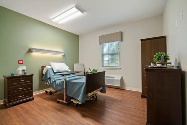 A well-furnished patient room in a nursing home