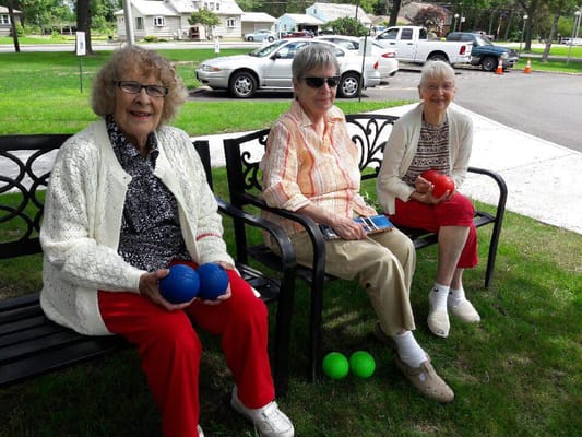 Residents enjoying outdoor activities with colorful balls