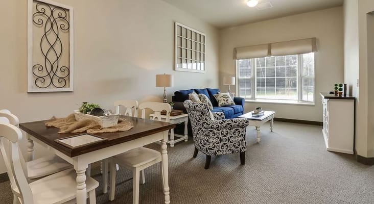 Stylish living room with a blue sofa and dining area