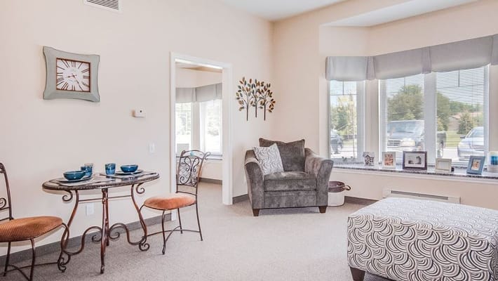 Inviting living room with a small table and armchair